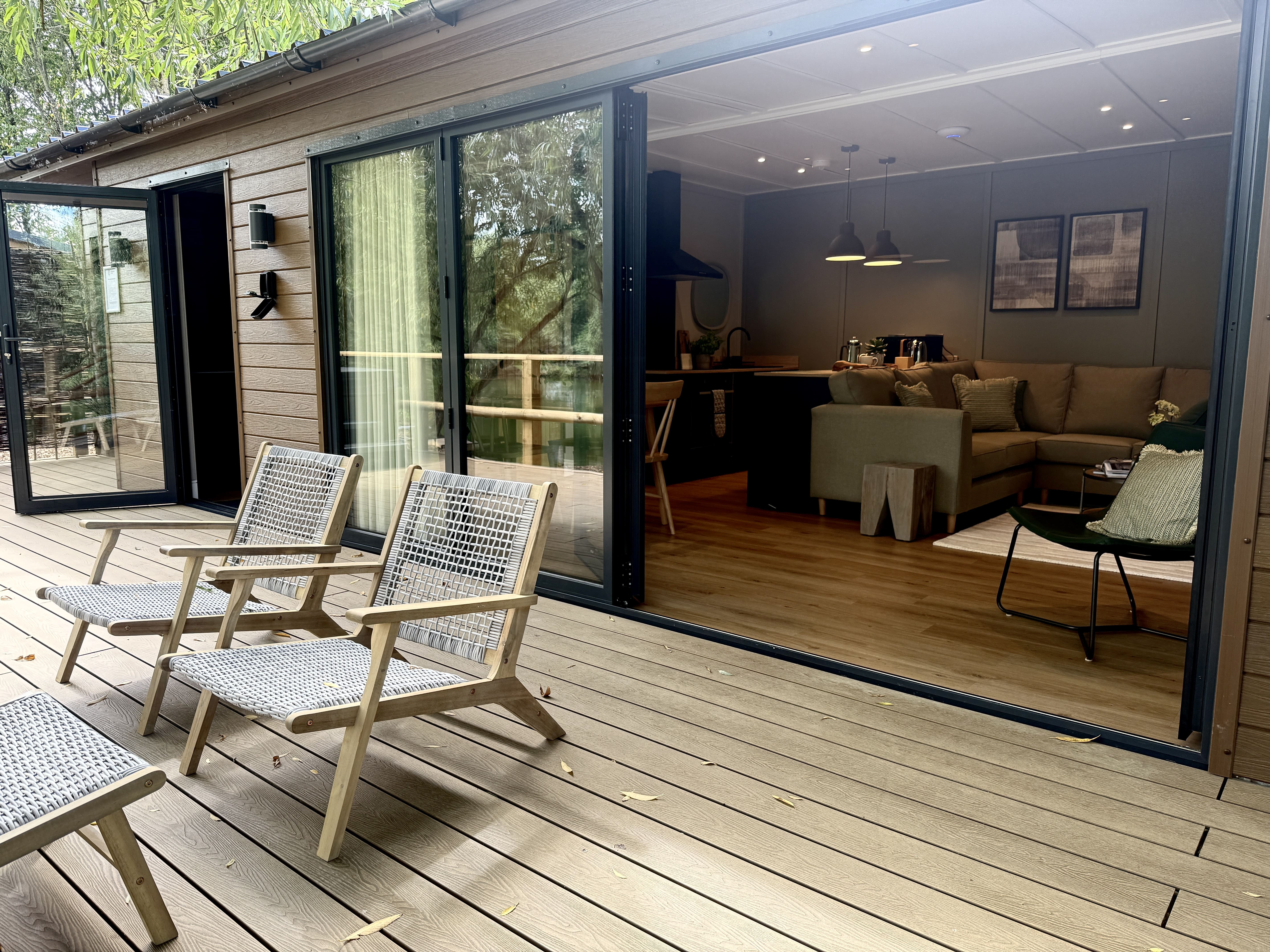 EcoHabs modular holiday lodge interior with floor-to-ceiling glazing